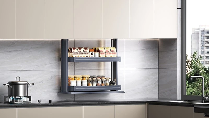 Elderly using electric lifting spice rack in kitchen Elderly using electric lifting spice rack in kitchen